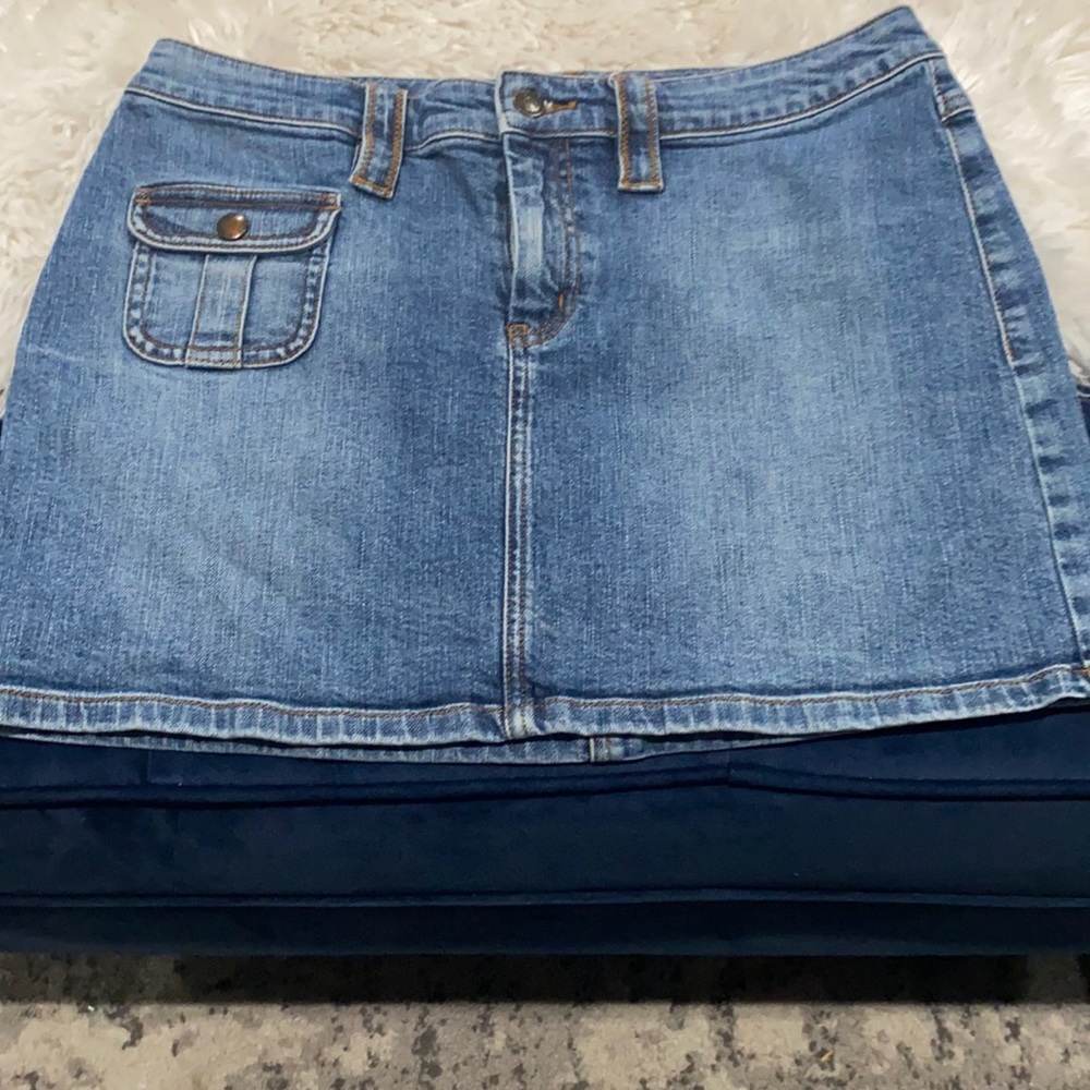 Excellent condition…Denim mini skirt with 1 front pocket and 2 back pockets